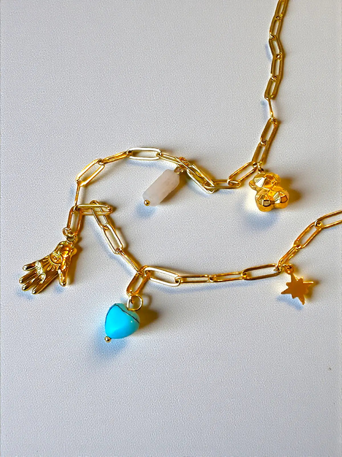 Auralis Charm Cascade Necklace Gold Charm Necklace with Turquoise Heart and Amulets